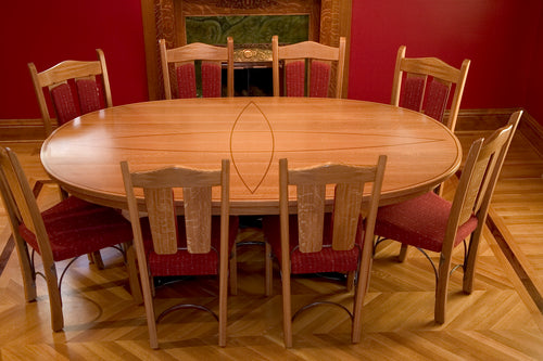 Quarter-sawn White Oak table, walnut inlay and wrought Iron base. Wrought iron seat frames.