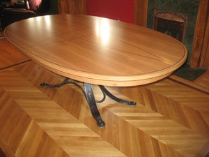 Quarter-sawn White Oak table, walnut inlay and wrought Iron base. Wrought iron seat frames.